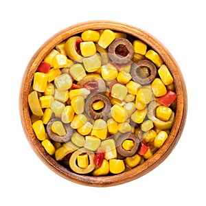 Mix of canned corn, sliced olives and diced peppers, in a wooden bowl