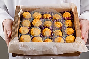 Corn muffins in the hands of the chef