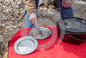 Corn pone and bacon cooked outdoors