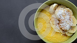 Corn porridge polenta, hominy. Healthy breakfast concept. Food Background