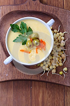 Corn porridge with vegetables on a wooden table