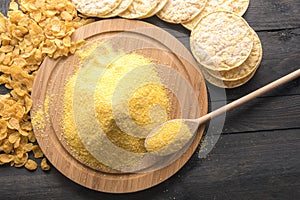 Corn products and flour on black table