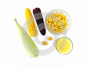 Corn, raw corn and boiled yellow and purple corn are placed on a