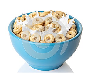 corn rings with splashing milk in blue bowl