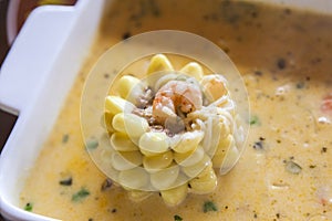 Corn and shrimp in sauce. Traditional peruvian dish
