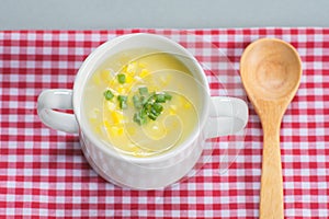 Corn soup in white bowl