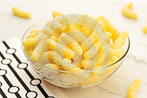 Corn sticks in bowl on table