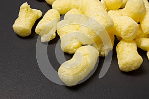 Corn sticks close-up on a dark background