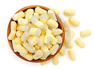 Corn sticks in a plate on a white background, isolated. Top view