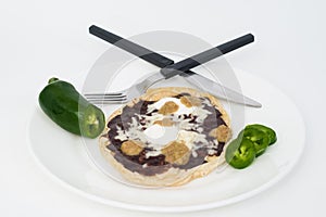 Corn tortilla with black beans and jalapenos photo