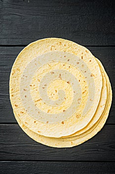 Corn Tortilla, on black wooden table background, top view flat lay  with copy space for text