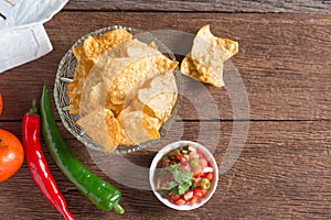 Corn tortilla chips with tomato salsa.