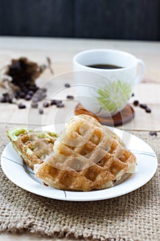 Corn vanilla and pandan thai waffle on white dish , selection f