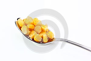 Corn in wooden bowl on table