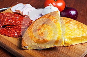 Cornbread with cheese, vegetables and meat