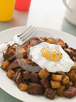 Corned Beef Hash With a Fried Egg and Black Pepper