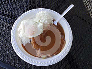 Corned Beef Hash With gravy, over easy egg and rice