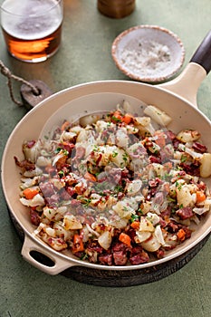 Corned beef hash with potatoes, cabbage and carrot
