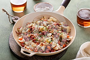 Corned beef hash with potatoes and carrots