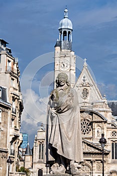 Corneille statue in paris with Saint etienne du Mont church