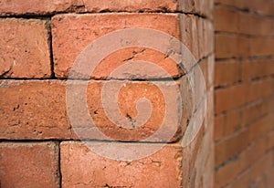 The corner of ancient red brick wall