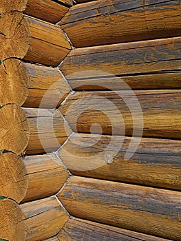 Corner with big wooden logs outdoors