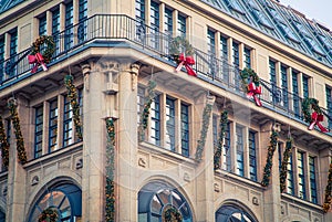 Corner of a building with Christmas decorations on it