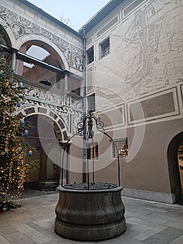 Corner of a building with an old well