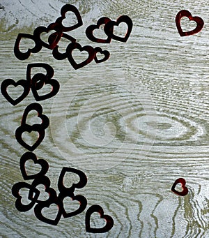 Corner frame border of Hearts on wooden background.