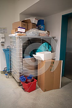 In a corner of a hospital hallway, the waste from the operating room