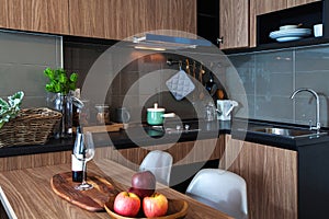Corner kitchen with dining table in room condominium.