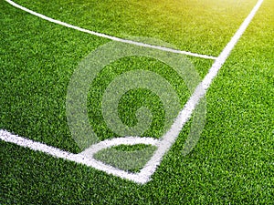 Corner line on green grass of futsal field or football field