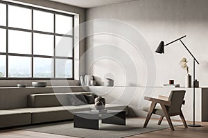 Corner of minimalist beige living room with armchair and slim lamp