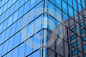 The corner of a modern glass building in Sydney central business district.
