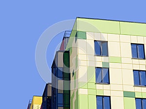 Corner of a new modern house against the blue sky