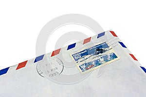 The corner of an old envelope with a redeemed stamp. Letter past US mail