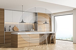 Corner of panoramic white kitchen with breakfast bar table