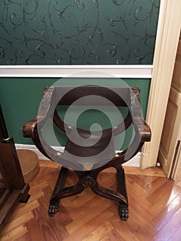 A corner in a room in the Iulia Hasdeu palace with a orange couch