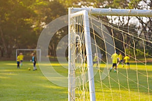 Corner of a soccer or football goal post with warm morning light