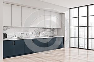 Corner view of blue and white kitchen cabinet