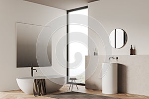 Corner view on bright bathroom interior with bathtub, panoramic window