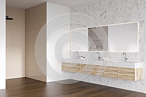 Corner view on bright bathroom interior with shower, large mirror