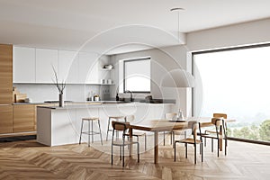 Corner view on bright kitchen room interior with panoramic window