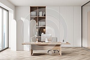 Corner view on bright white office room interior with meeting board, desk with desktop computer, armchair, panoramic windows,