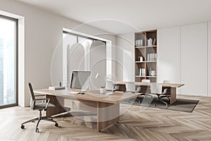 Corner view on bright white office room interior with meeting board, desk with desktop computer, armchair, panoramic windows,