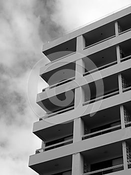 Corner view of concrete generic white modern apartment building