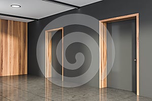 Corner view of office room interior with grey empty wall