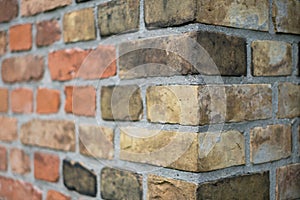 Corner of a vintage brick wall , stone brick wall edge