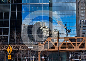 Corner of Wacker Drive and Lake Street in Chicago Loop, with Merchandise Mart reflected in a mirrored building exterior, and Photo photo