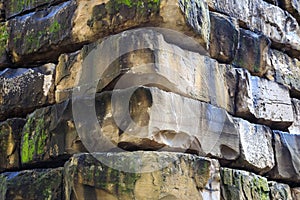 The corner of a wall made of large stone blocks